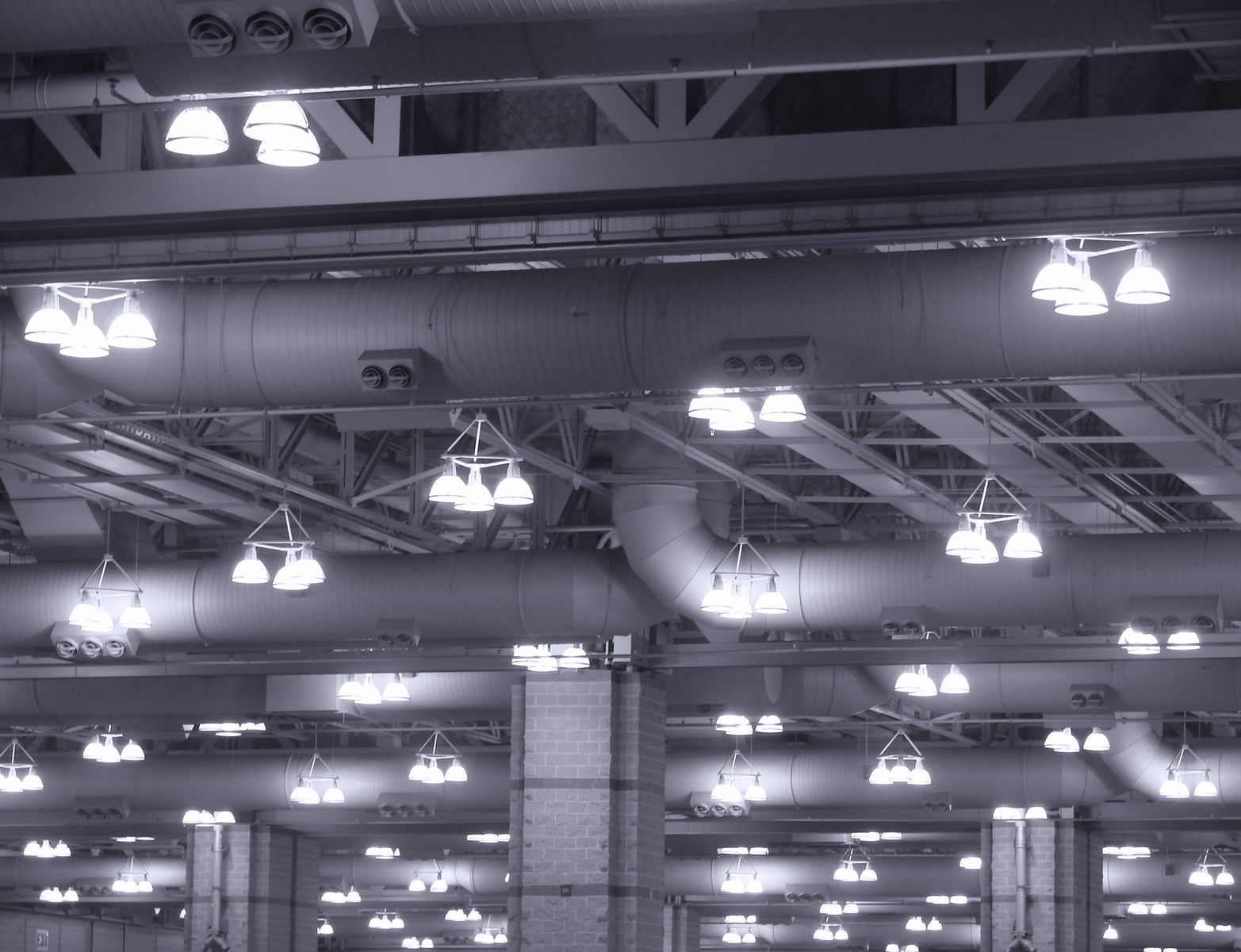 1573929 - overhead hanging lights in an industrial building